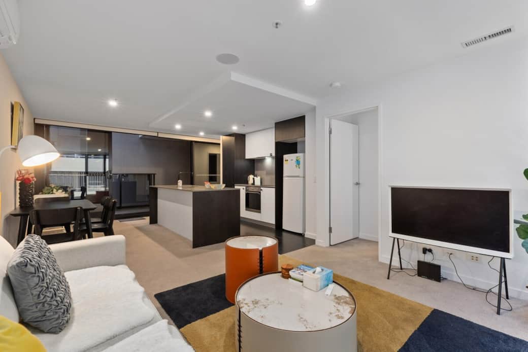 Welcome to your new home away from home. Our open-concept living space is designed for comfort and style, featuring a modern kitchen, cozy dining area, and a relaxing lounge zone complete with a flat-screen TV.
