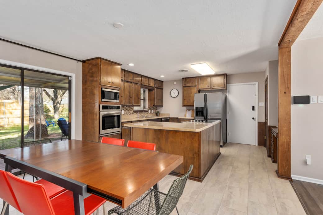 Spacious & bright kitchen is completely stocked with all the cooking & dining necessities. Spacious & bright kitchen is completely stocked with all the cooking & dining necessities.