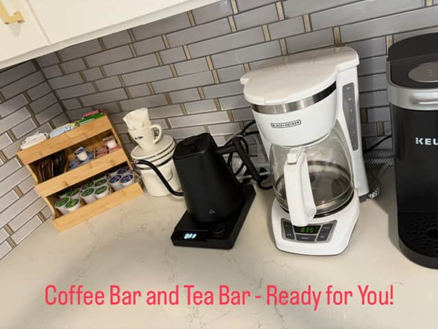 Coffee station with supplies in the kitchen at White Magnolia Galveston