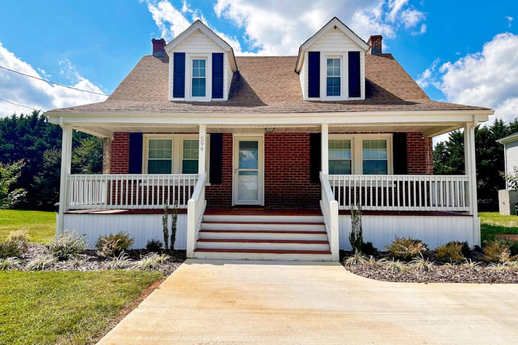 Front of home, nice large porch with chairs for sitting outside!