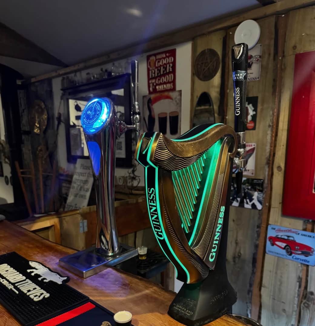 Guinness draught beer taps in the private Shebeen bar at The Hideaway Muff, exclusive golf group accommodation in Donegal.