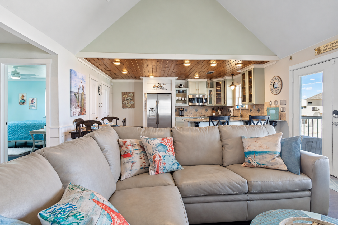 Open-concept living room facing the kitchen and dining area