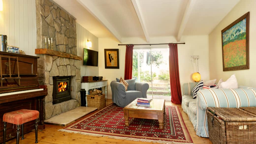 Bawley Ridge_Farmhouse East_Living room_fire_1200x675_holiday accommodation nsw south coast