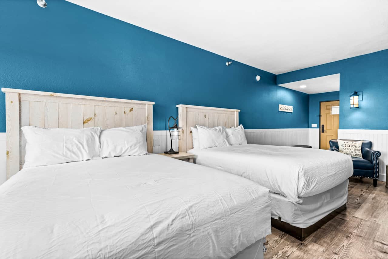 Two plush queen beds for a restful lakeside stay