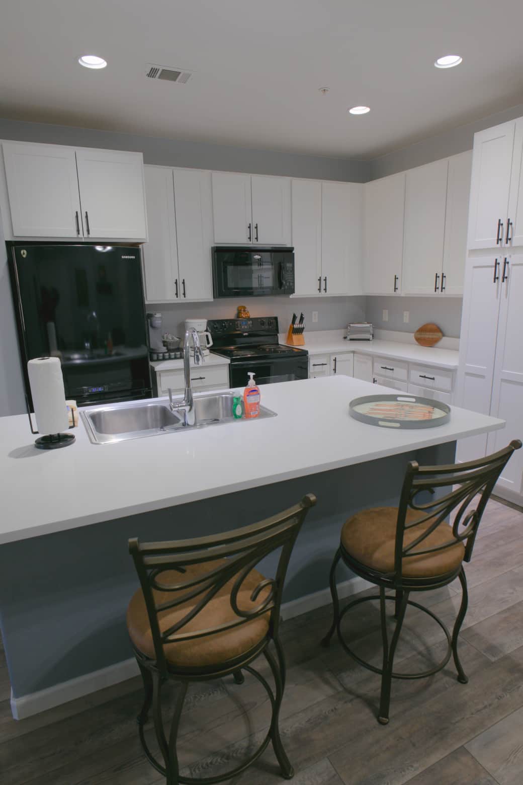 Fully equipped kitchen with spacious island for gathering, plus drip coffee, K-cups, and tea pods.