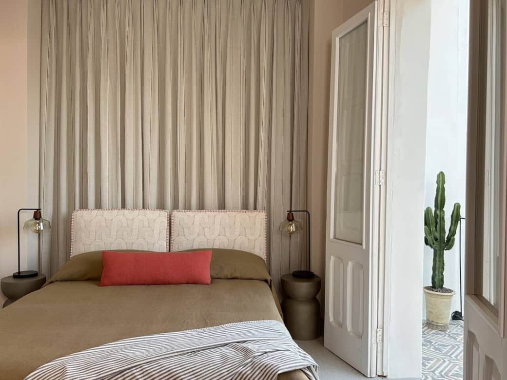 The secluded bedroom’s has its own balcony with views of the quiet neighbourhood 
