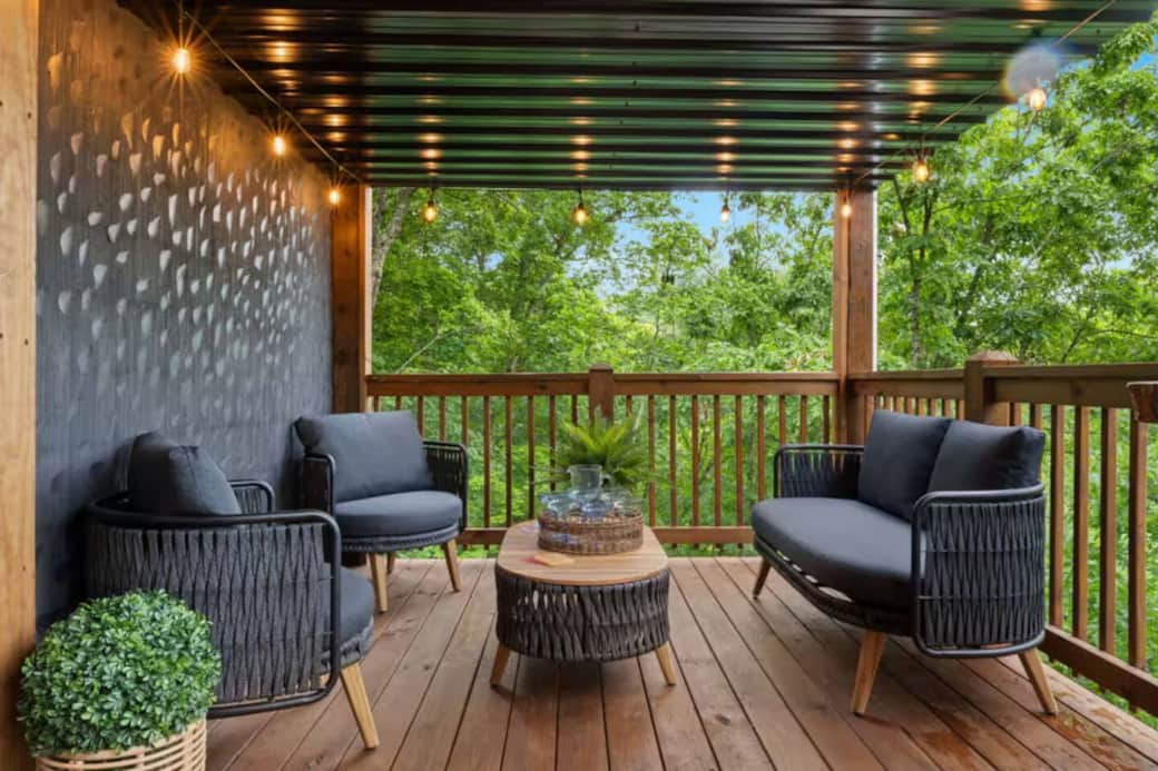 The covered lower-level rear deck features a relaxing lounging area perfect for winding down. Comes equipped with a golf putting game, corn hole, and board games.