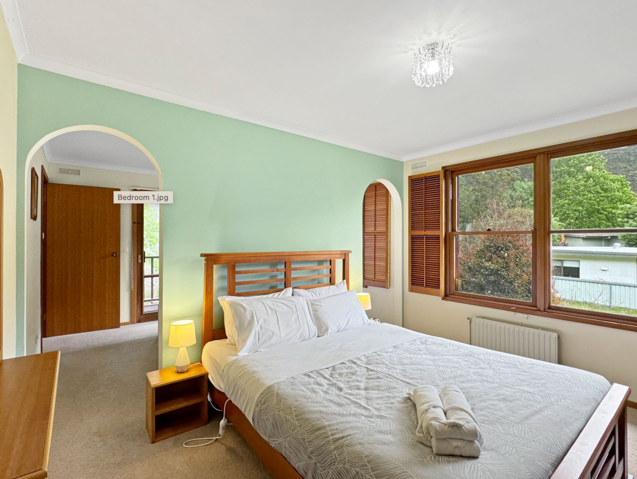 Cozy Queen Room: Upstairs retreat for a restful stay. Comfort and convenience await.