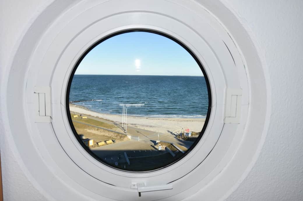 Porthole view of the Baltic Sea, Baltic Sea lounge, living room Heiligenhafen
