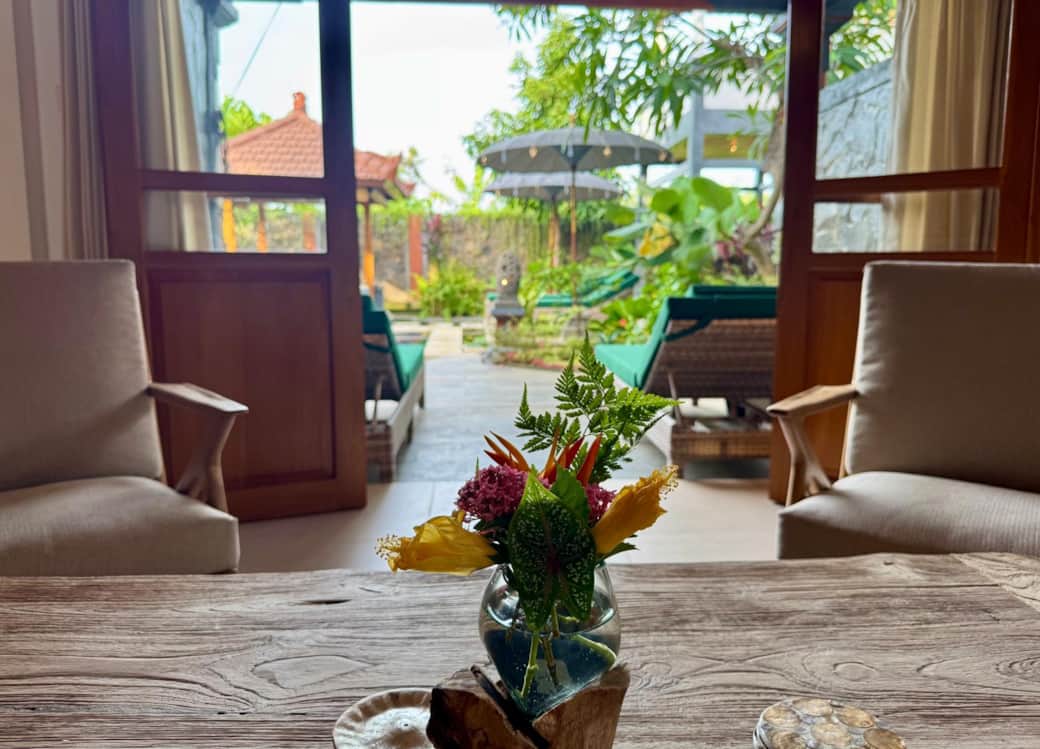Seating area with double doors to pool terrace 