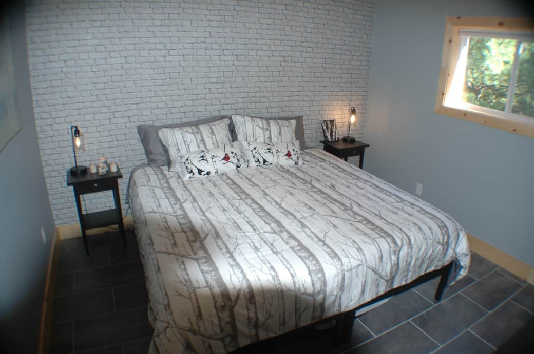 Guest bedroom in a king bed configuration, includes TV