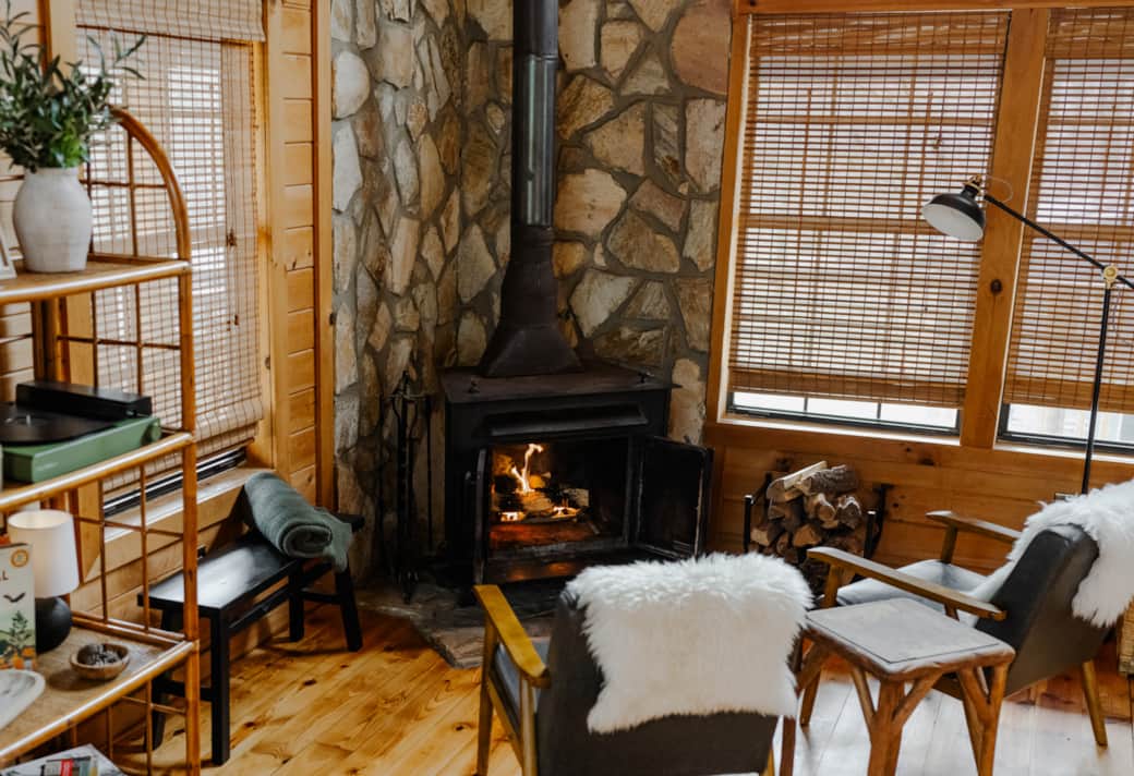 Wood stove and mini lounge (usage guide included). Starter bundle of wood & kindling provided.