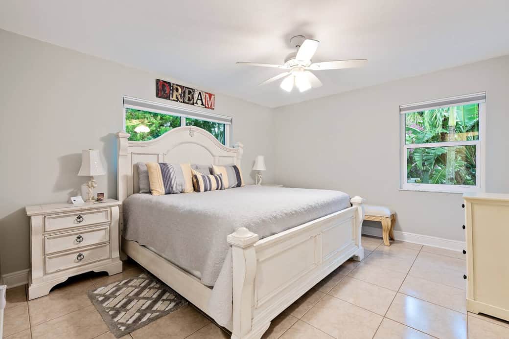 Master Bedroom with King size bed and beautiful views of the backyard. Blinds close to black out the room for late morning sleepers and a large closet is available to store your luggage. Also attached is a private half bathroom.