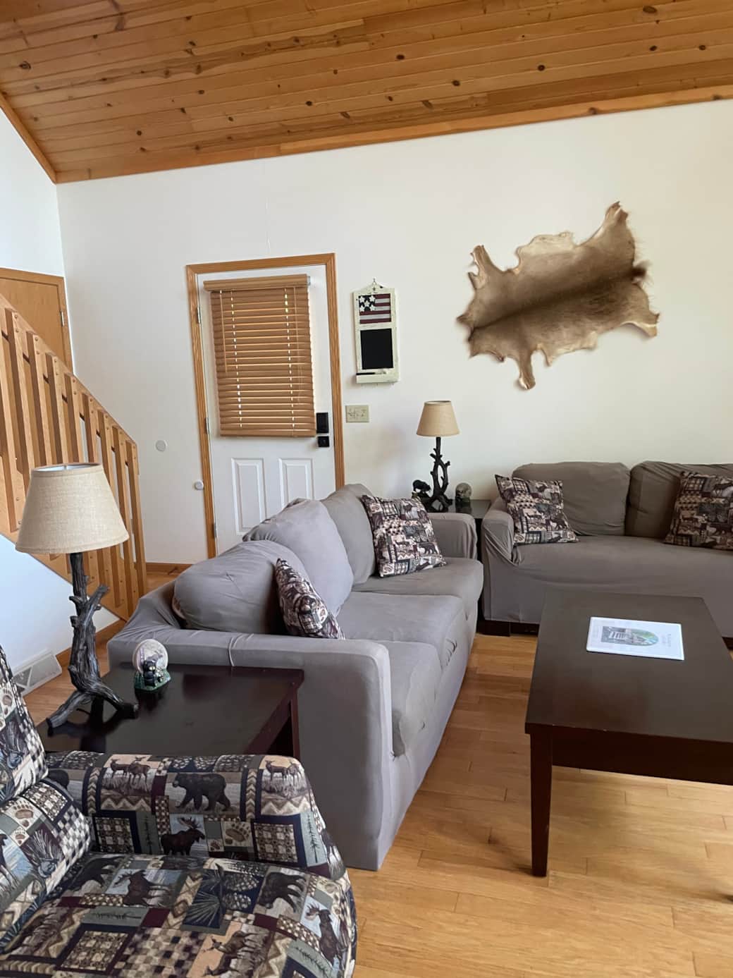 Large Great room setup with 22 ft ceilings and wood-burning fireplace