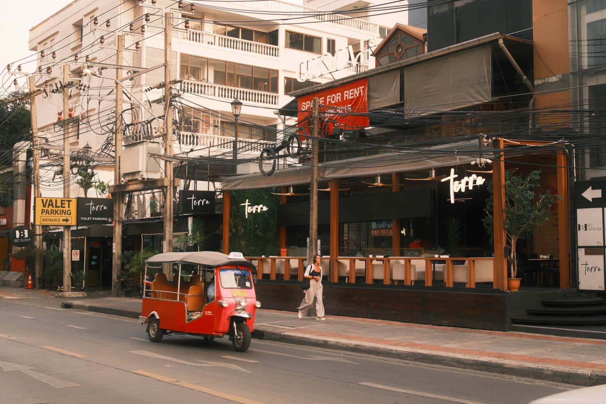 Dining, lights, and passing tuk-tuks