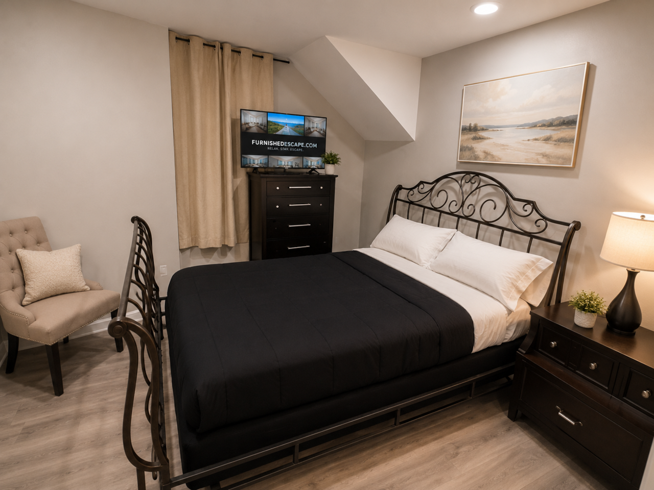bedroom 3:Comfortable and inviting bedroom featuring a queen-size bed with crisp bedding, warm bedside lighting, and stylish décor. The room also includes a Smart TV, dresser for extra storage, cozy seating, and modern flooring—perfect for relaxing after a long day.