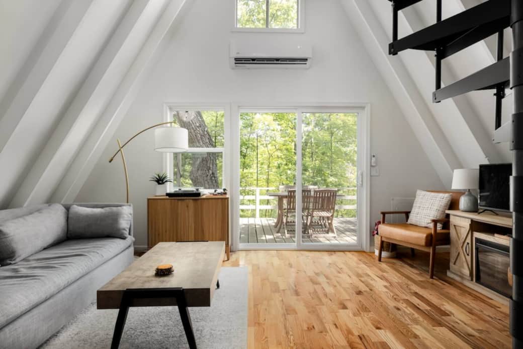 Step into your mountain sanctuary. Open-concept living area blends modern comfort with the natural beauty of the Shenandoah Valley just outside the door. Whether you're relaxing on the sofa or enjoying the view, this is the perfect spot to slow down.