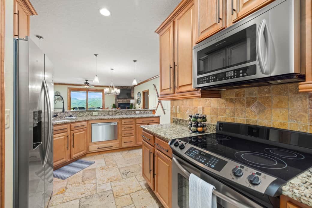 Kitchen view open to dining and living areas
