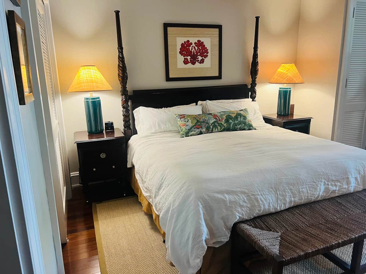 Rest easy in this plush master suite bed featuring fresh linens and a relaxing Harbour Island vibe