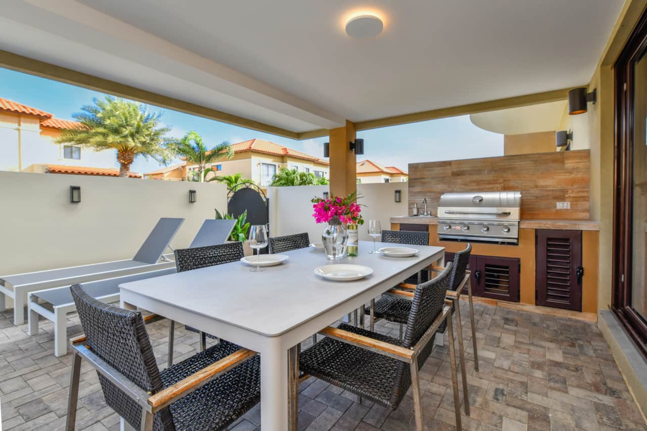 Gazebo-covered outdoor dining table  and BBQ area