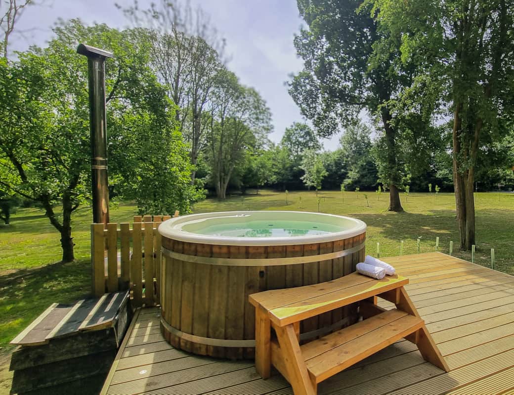 Hot tub, deck and grounds. Summer