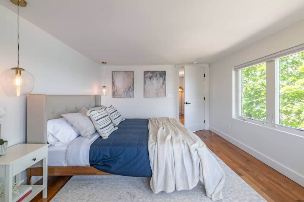Second floor bedroom with ocean view! If you're lucky enough you can wake up to a beautiful sunrise without leaving the bed! 