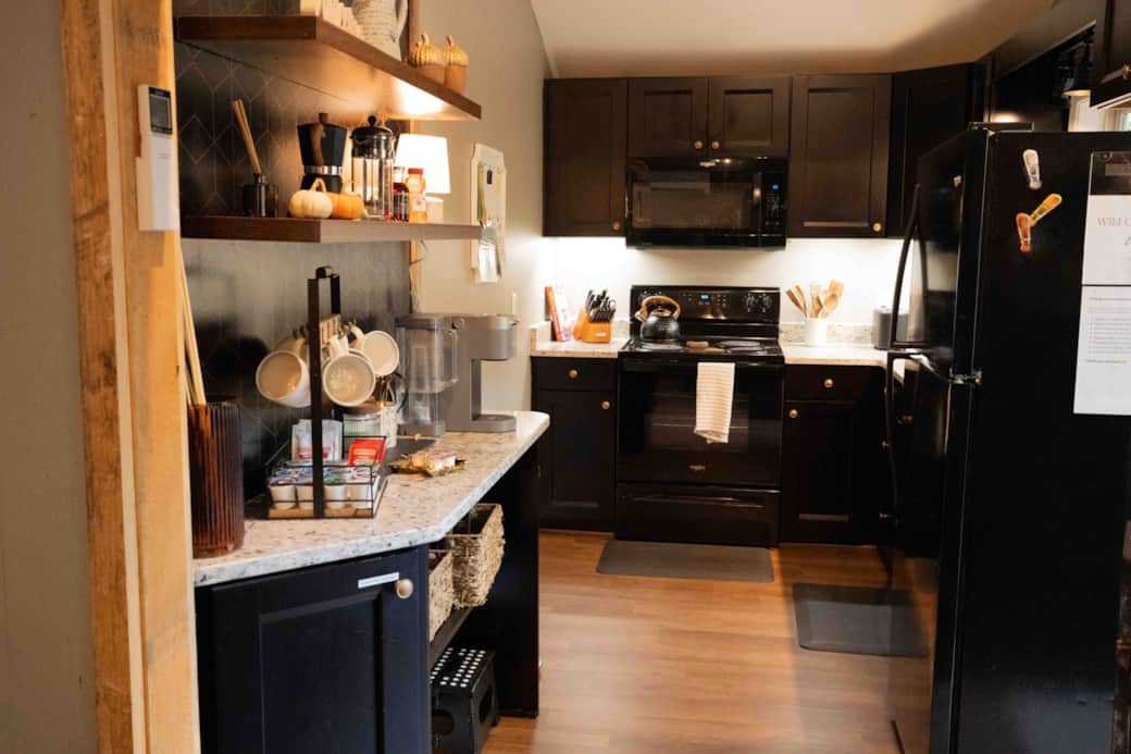 Coffee bar, stove, microwave, full size refrigerator, tableware & cookware for full service cooking. Coffee bar, stove, microwave, full size refrigerator, tableware & cookware for full service cooking.