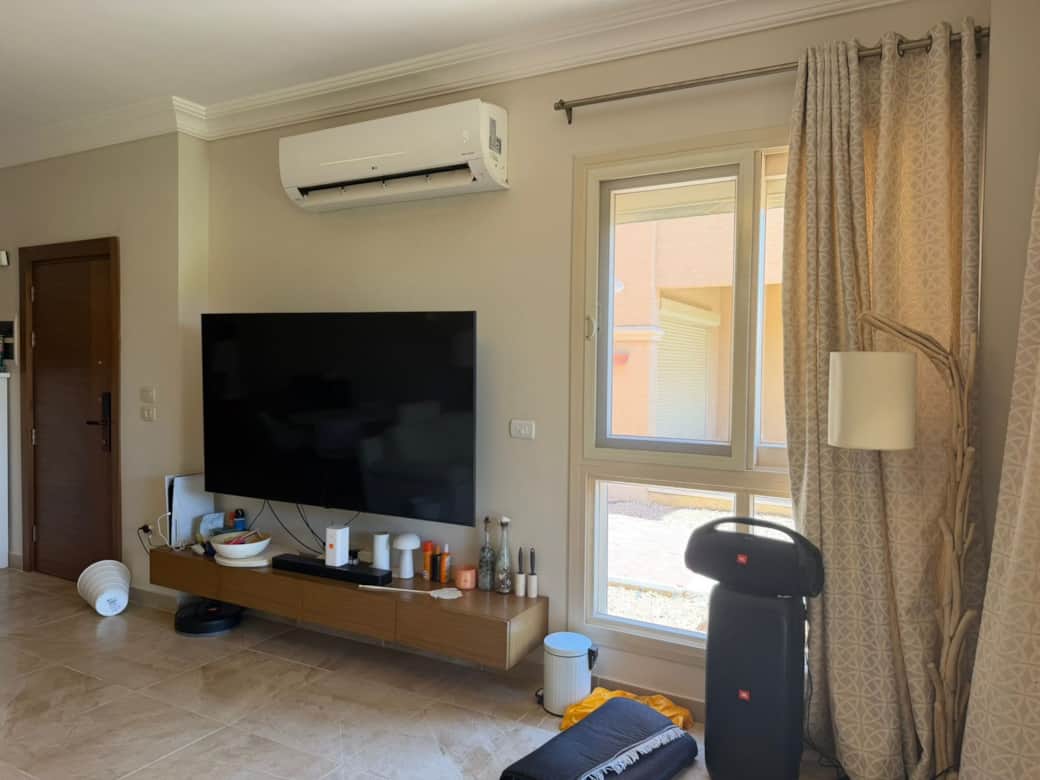 Living room with TV 80-inch and portable beach speakers Living room with TV 80-inch and portable beach speakers