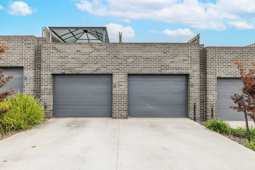 Arrive at your new home with a warm welcome. Our double garage doors offer secure parking for two vehicles, setting the stage for a comfortable stay. The exterior's modern design with a touch of greenery promises a tranquil environment.