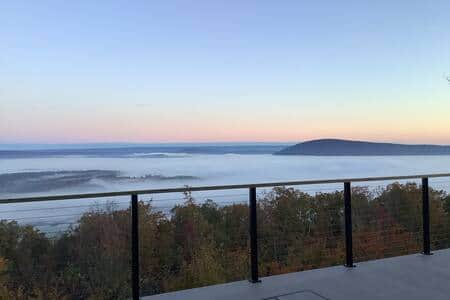 Back deck. The fog hanging low with a sunrise. 