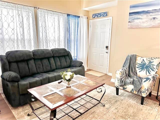 Our spacious living room is designed with your comfort in mind. The sofa has 2 built-in recliners 