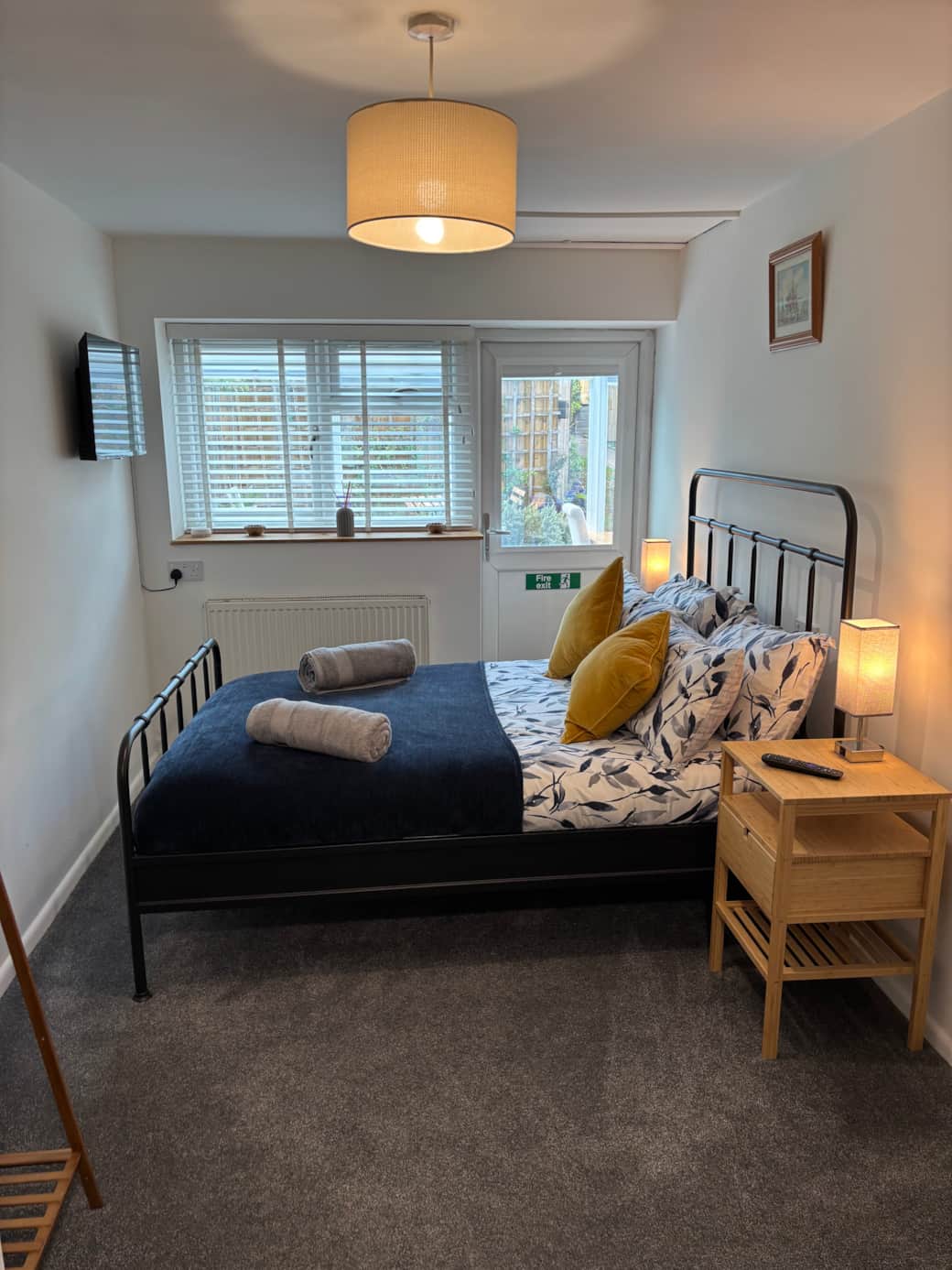 Light and airy bedroom with smart TV