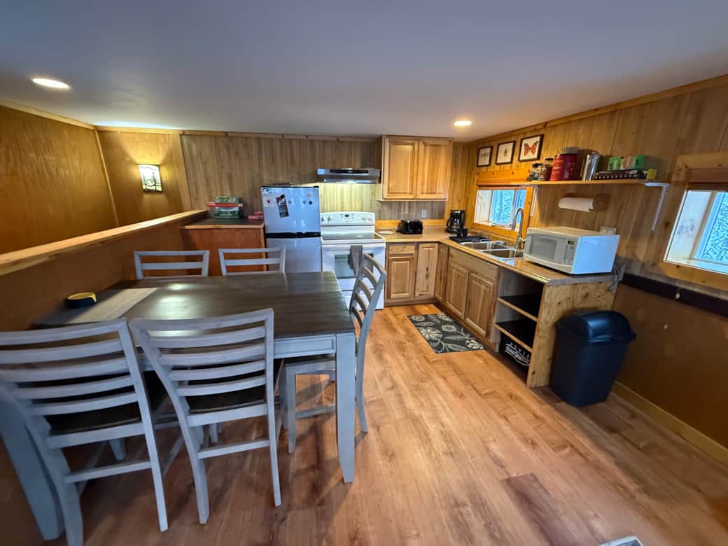 well stocked kitchen and large dining table well stocked kitchen and large dining table