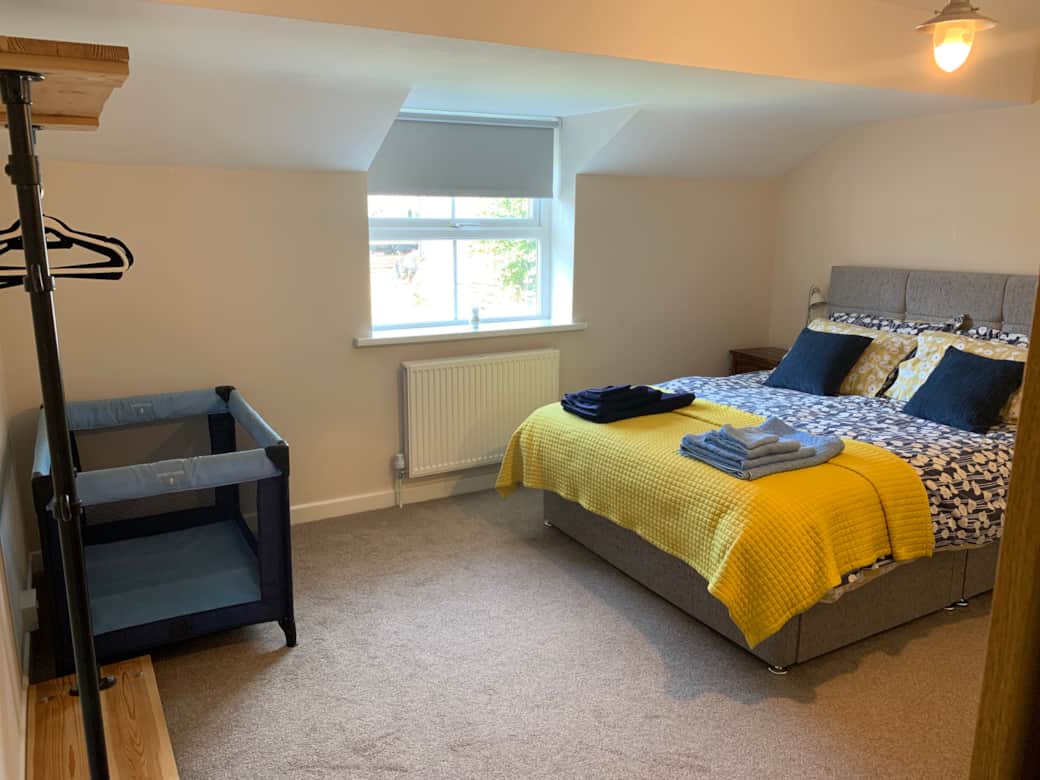 Master bedroom with optional travel cot.