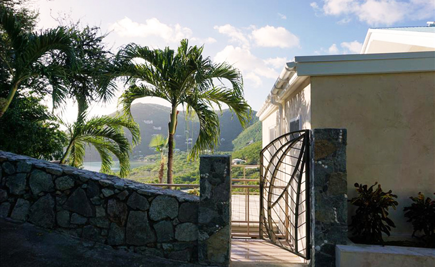 Exterior side entrance staircase leads to the pool deck