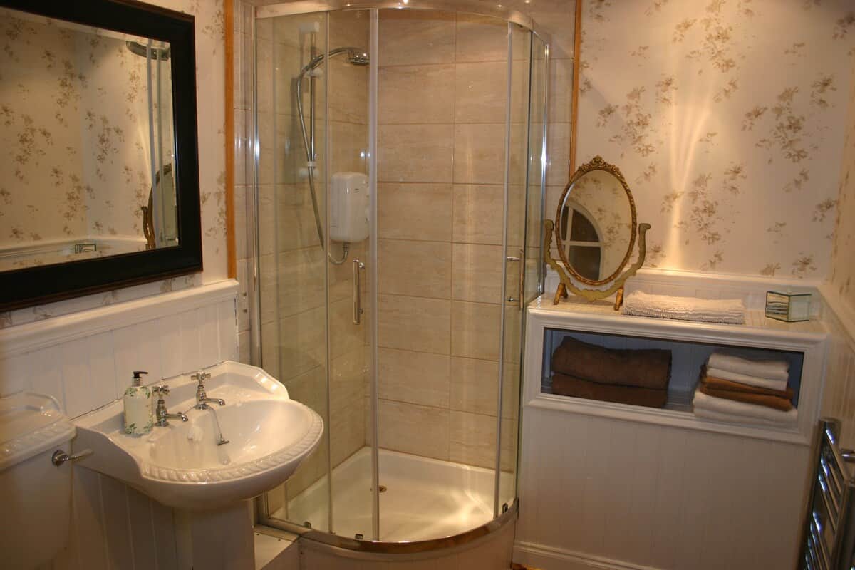 Bathroom incorp shower sink and WC with heated towel rail