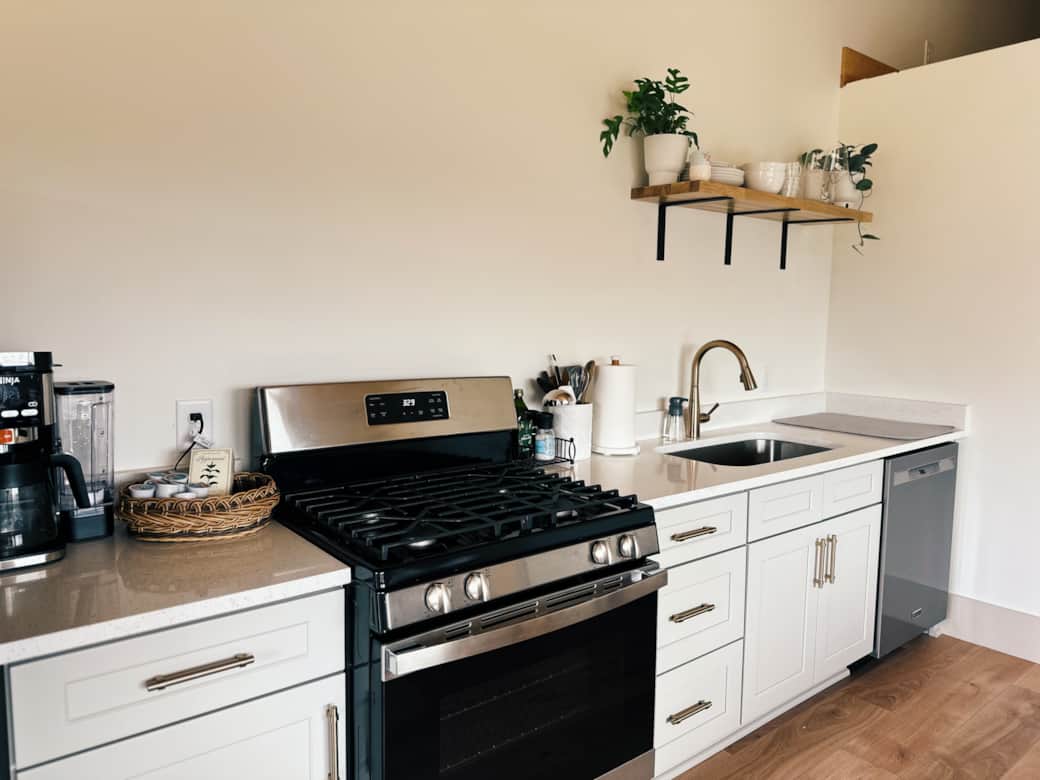 Gorgeous full kitchen with fridge, gas stove, dishwasher, mirrored quartz countertops Gorgeous full kitchen with fridge, gas stove, dishwasher, mirrored quartz countertops