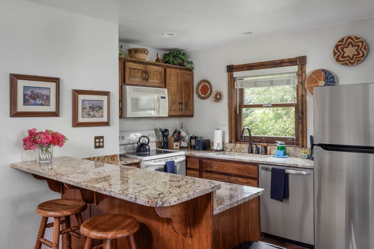 Open and light fully stocked kitchen with updated appliances