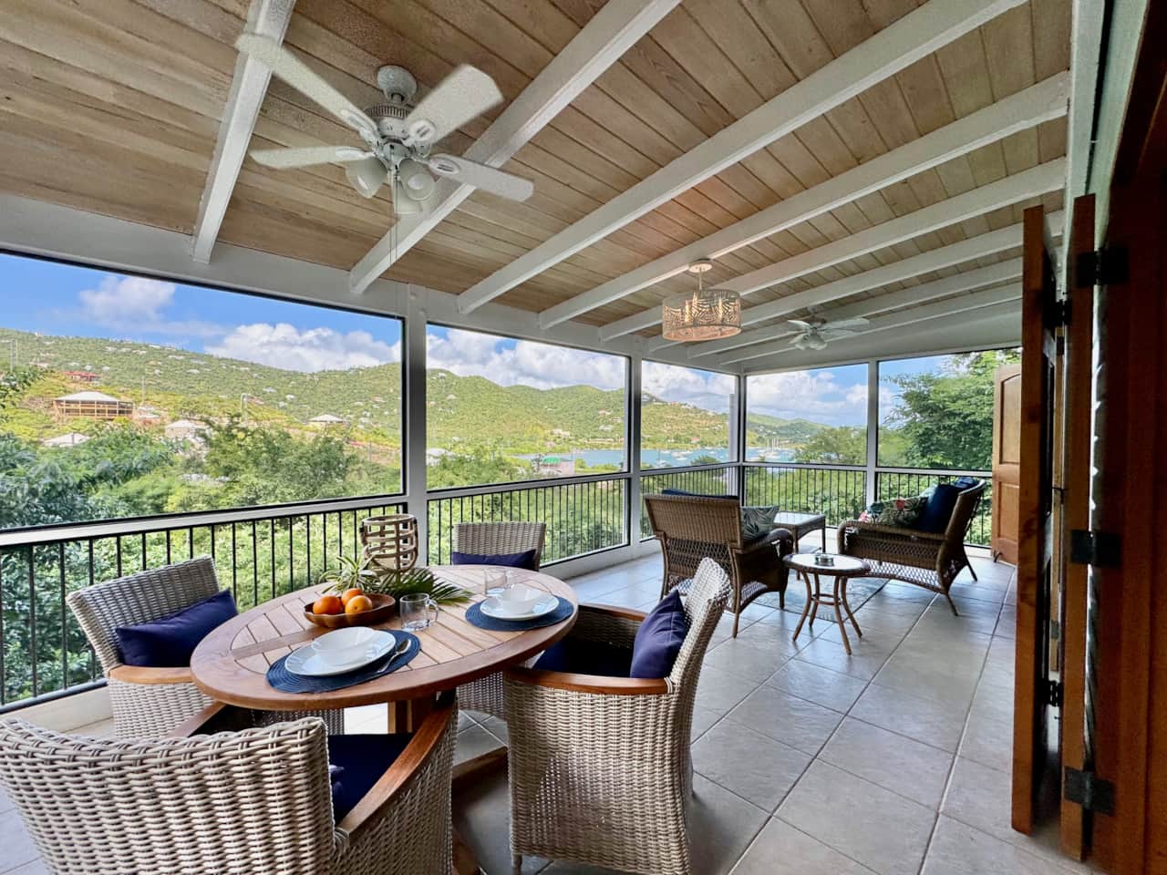 Spacious screened in porch with plenty of seating