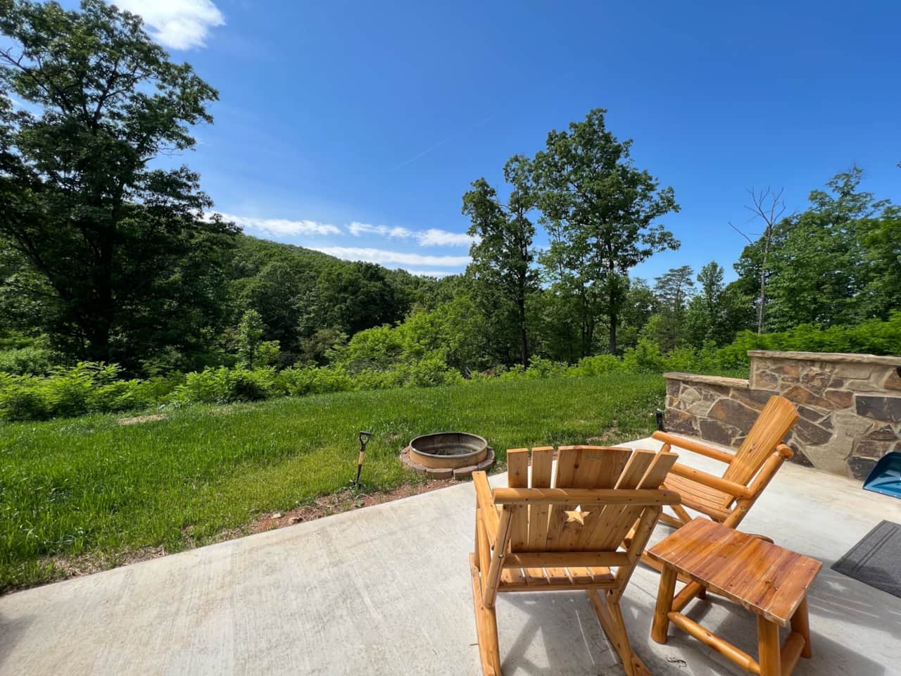 Enjoy your private patio with expansive views of Roundhead Mountain and surrounding wooded acreage