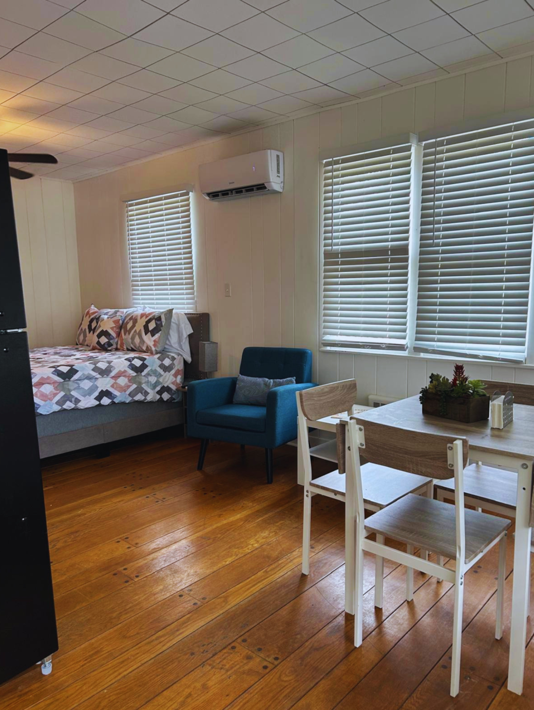 Cozy bedroom with a comfortable bed and accent chair for reading or relaxing. Lakeland, FL