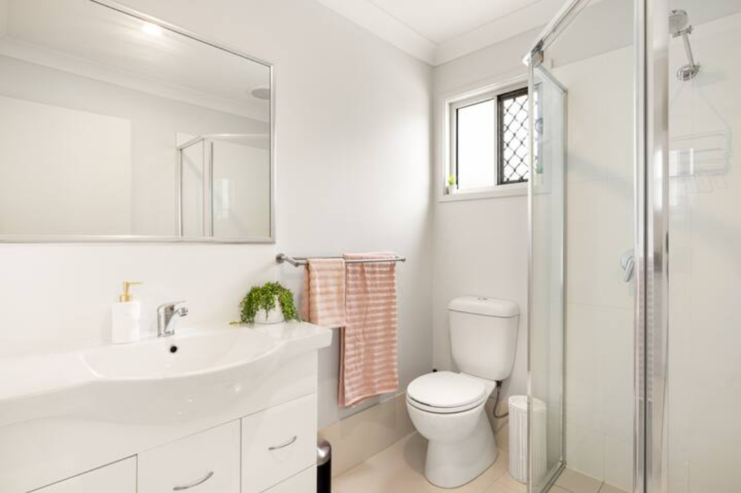 Bathroom: Stylish bathroom with walk-in shower, vanity, and clean finishes 
