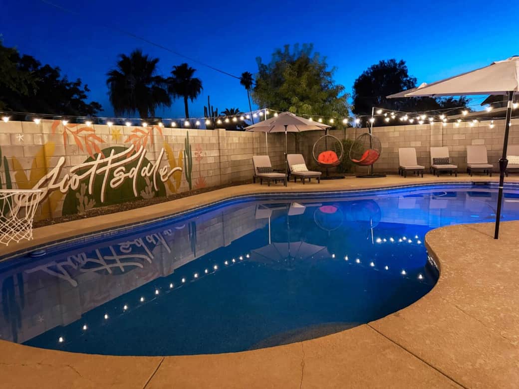 Patio lights add a warm ambiance, making evenings by the large pool especially inviting. Everyone has a spot to relax with 10 poolside lounge chairs in addition to the 2 basket swing chairs. 