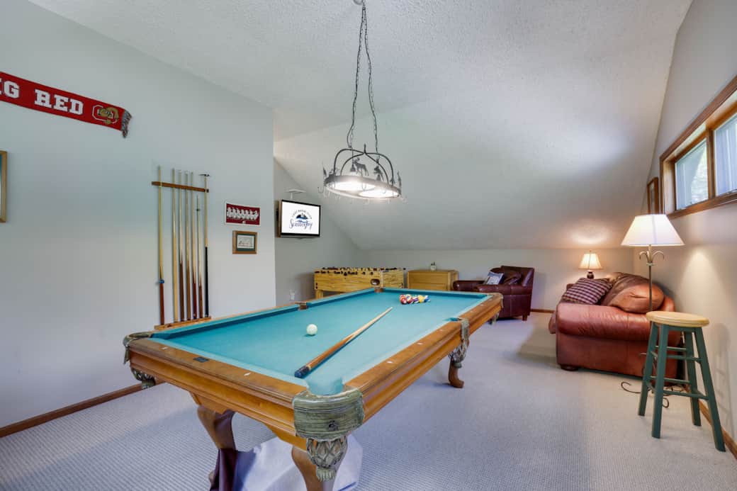 Game room with Brunswick billiards and Foosball