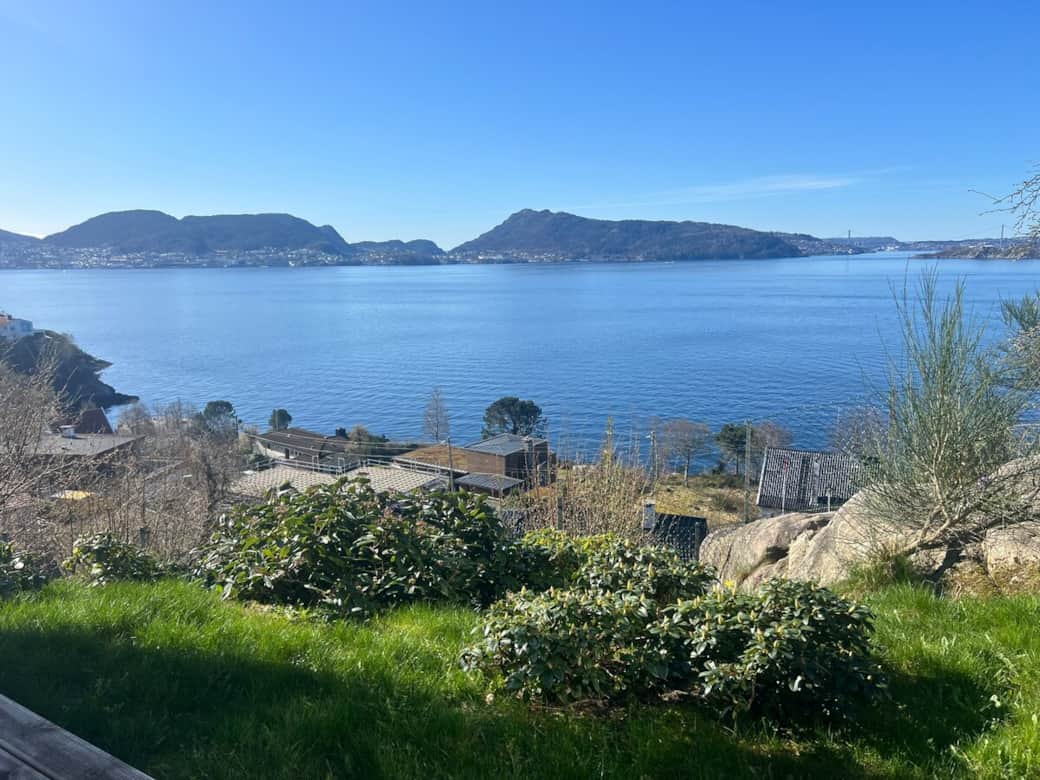The garden outside the apartment features a sloping area planted with rhododendron bushes The garden outside the apartment features a sloping area planted with rhododendron bushes