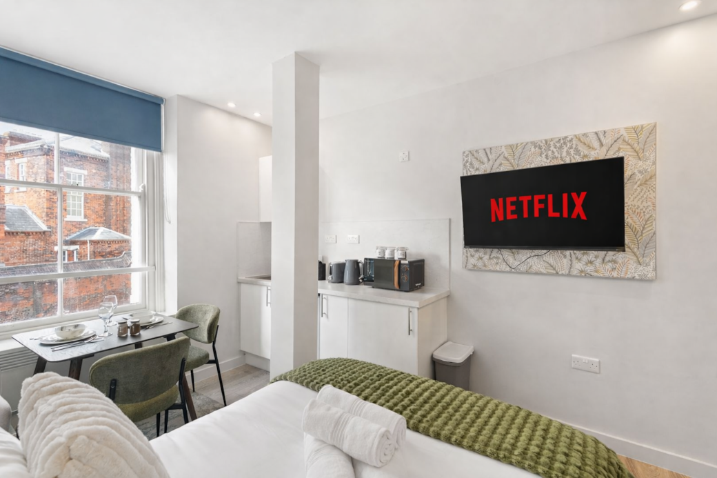 A bright, modern bedroom with a luxurious double bed, dining space for two and Smart TV with Netflix A bright, modern bedroom with a luxurious double bed, dining space for two and Smart TV with Netflix