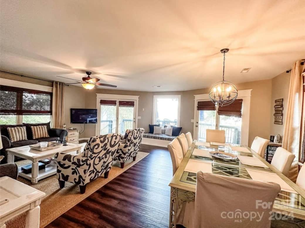 Spacious Living Room and Dining Room area with plenty of seating that overlooks the beautiful, long range water view. Spacious Living Room and Dining Room area with plenty of seating that overlooks the beautiful, long range water view.