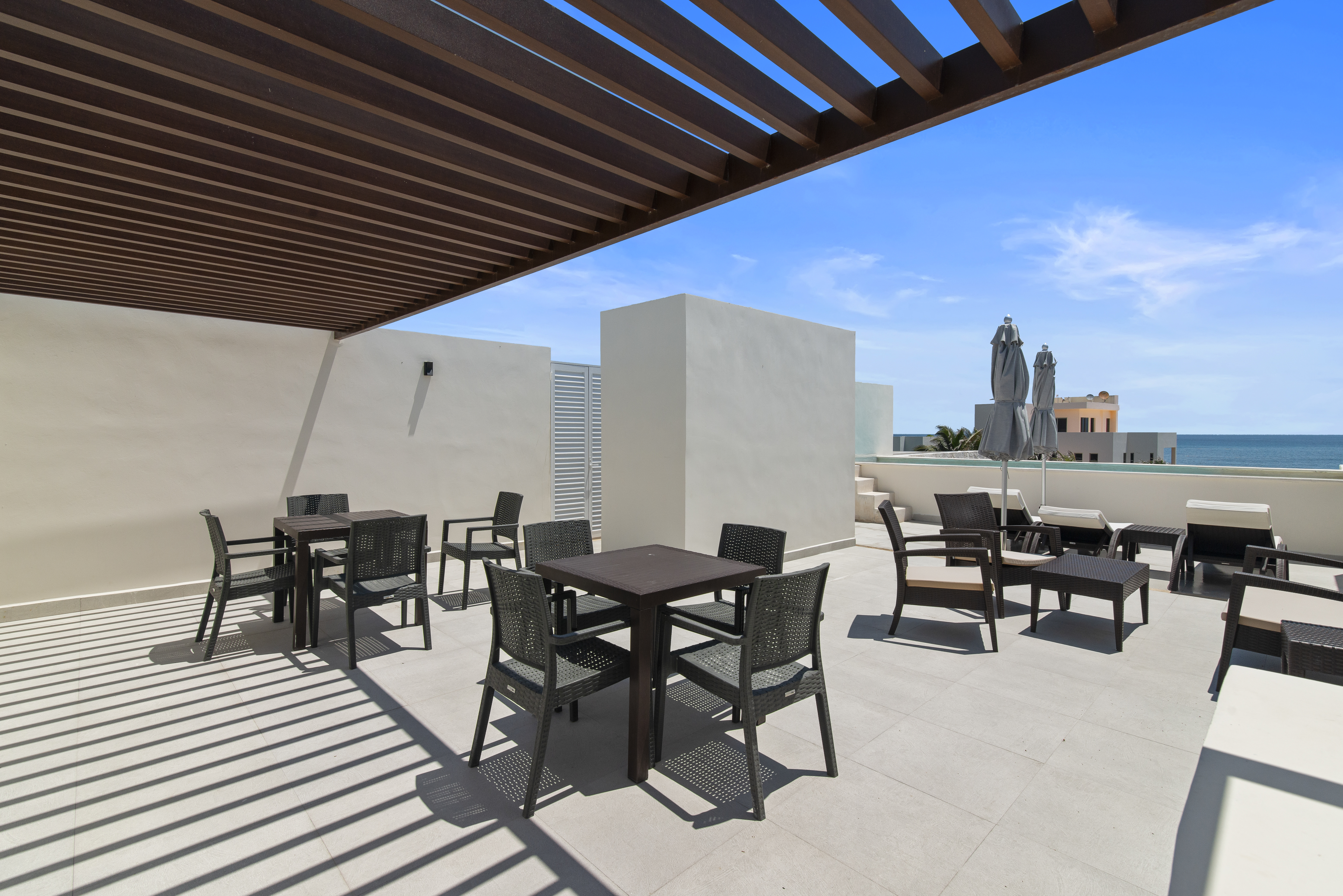 Dine or unwind by one of 7 rooftop pools with ocean views, loungers, umbrellas, and nearby restrooms