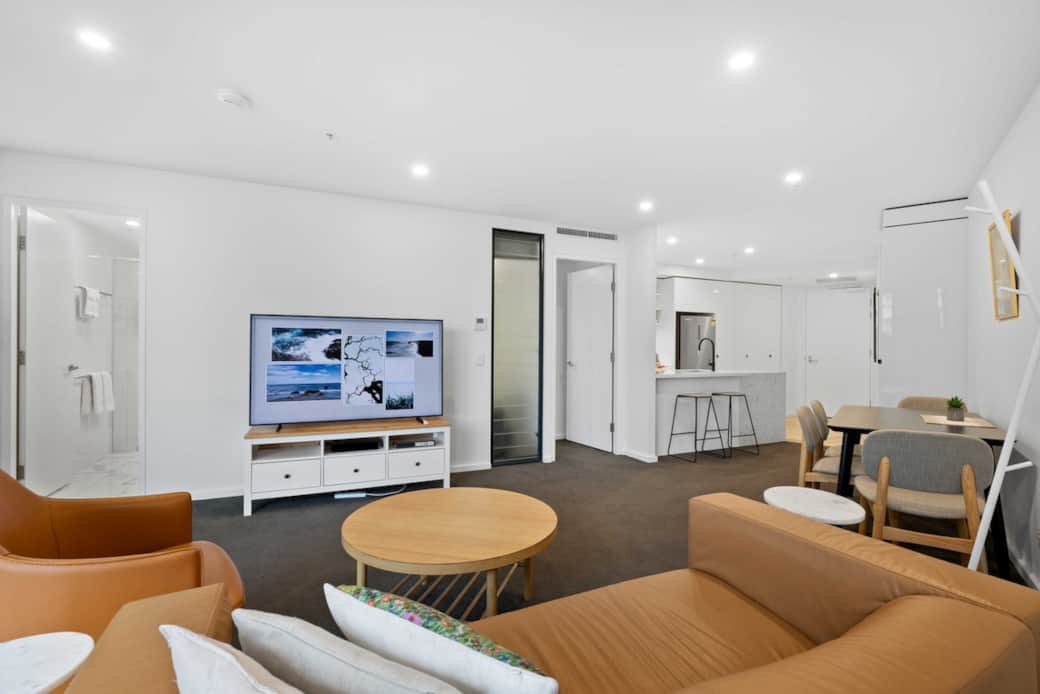 Immerse yourself in the comfort of our spacious living room. The plush sofas and cozy armchairs create an inviting atmosphere for relaxation or socializing. The Samsung 65 inch 4k flat screen TV and entertainment system promise hours of enjoyment.