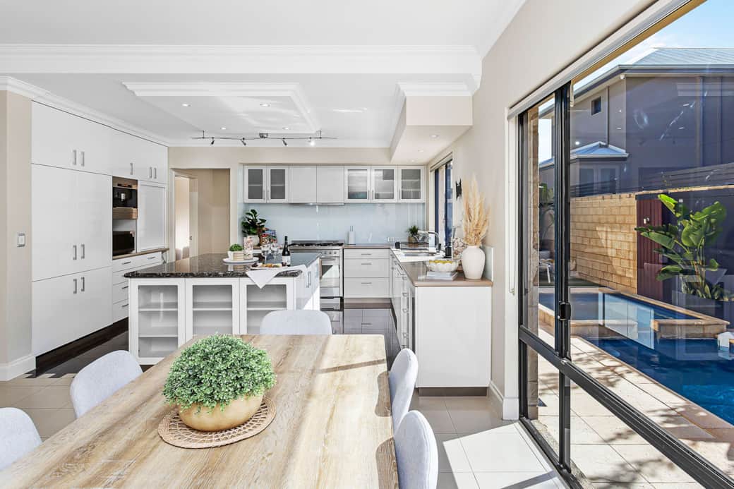 Enjoy the sleek kitchen with Miele appliances, flowing to dining with pool views. Enjoy the sleek kitchen with Miele appliances, flowing to dining with pool views.